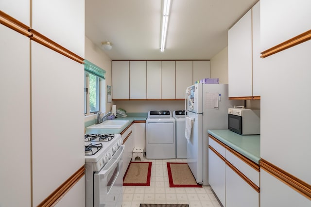 402 2nd Ave SE, Mapleton, MN 56065 - kitchen with white appliances, separate washer and dryer, white cabinetry, and light floors