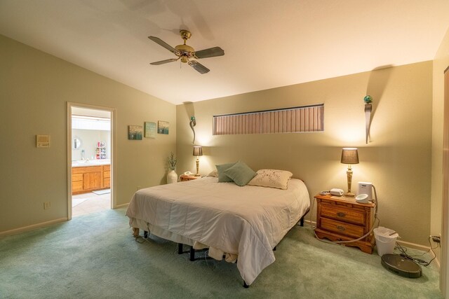 402 2nd Ave SE, Mapleton, MN 56065 - bedroom with light colored carpet, vaulted ceiling, baseboards, ensuite bathroom, and a ceiling fan