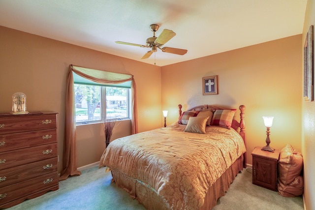 402 2nd Ave SE, Mapleton, MN 56065 - bedroom featuring light carpet, baseboards, and ceiling fan