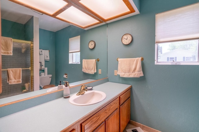 402 2nd Ave SE, Mapleton, MN 56065 - full bath with toilet, a shower stall, and vanity