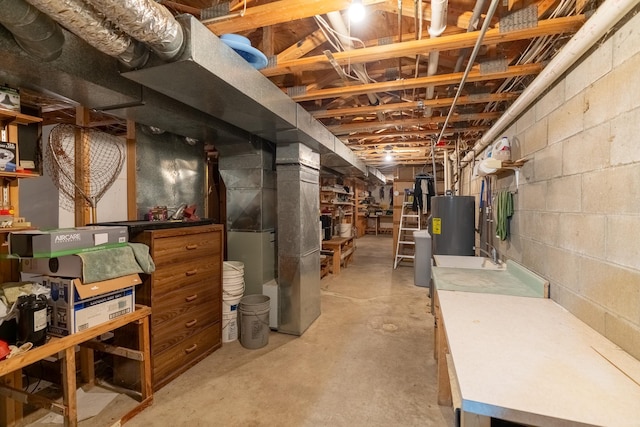 402 2nd Ave SE, Mapleton, MN 56065 - unfinished below grade area featuring water heater, heating unit, and concrete block wall