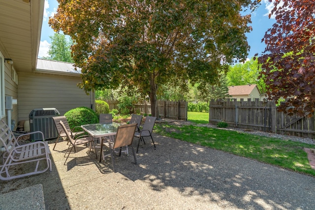 402 2nd Ave SE, Mapleton, MN 56065 - view of patio / terrace featuring cooling unit, fence, and outdoor dining space