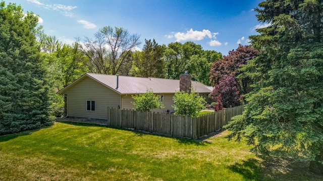 402 2nd Ave SE, Mapleton, MN 56065 - view of home's exterior featuring a chimney and metal roof
