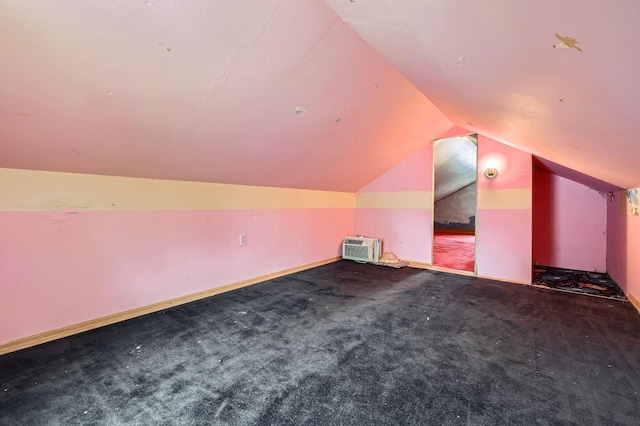 bonus room with vaulted ceiling, carpet flooring, baseboards, and a wall mounted AC