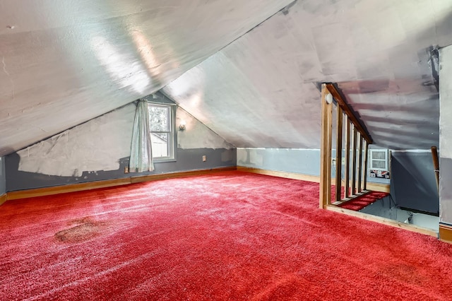 bonus room featuring carpet and vaulted ceiling