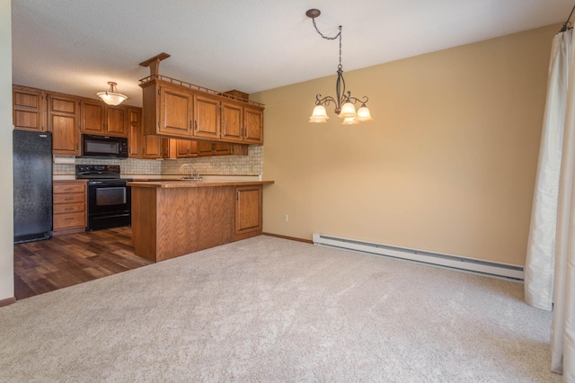 1346 Latoka Drive Ct SW, Alexandria, MN 56308 - kitchen with black appliances, a baseboard heating unit, dark carpet, brown cabinets, and backsplash