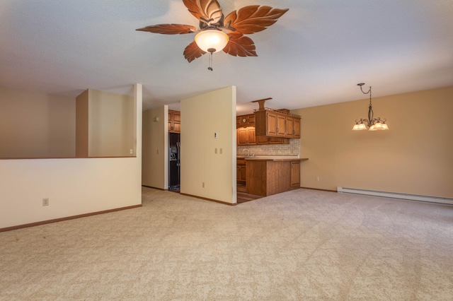 1346 Latoka Drive Ct SW, Alexandria, MN 56308 - unfurnished living room with baseboard heating, light carpet, a chandelier, and ceiling fan