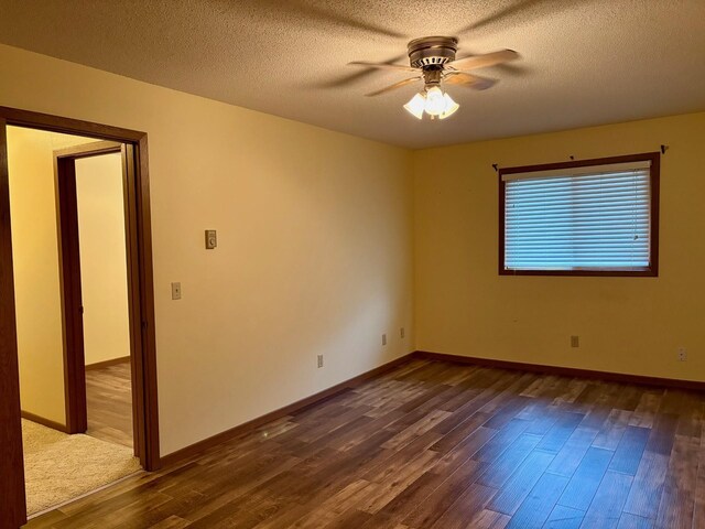 1346 Latoka Drive Ct SW, Alexandria, MN 56308 - empty room with dark wood finished floors, a ceiling fan, and a textured ceiling