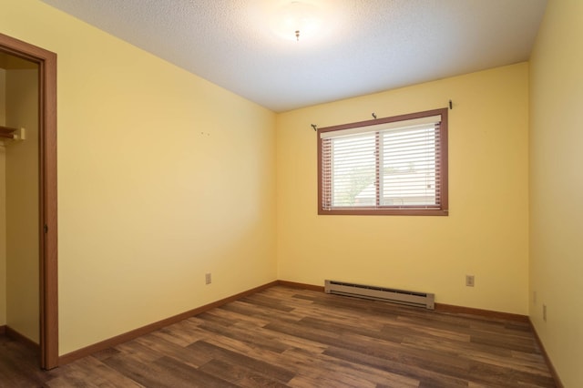 1346 Latoka Drive Ct SW, Alexandria, MN 56308 - unfurnished room featuring a baseboard radiator, dark wood-type flooring, and a textured ceiling