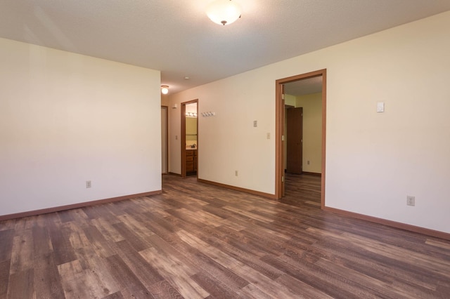 1346 Latoka Drive Ct SW, Alexandria, MN 56308 - unfurnished room featuring dark wood-style flooring and baseboards