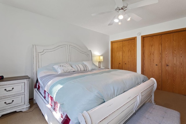 20441 Elmwood Rd, Lynden Twp, MN 55320 - bedroom featuring light colored carpet, two closets, and ceiling fan