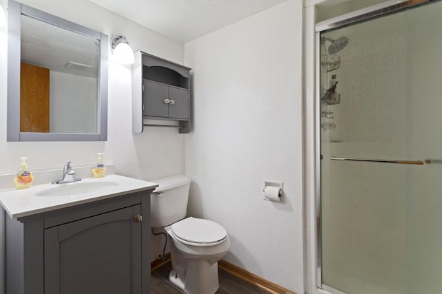 20441 Elmwood Rd, Lynden Twp, MN 55320 - bathroom with a shower stall, toilet, wood finished floors, vanity, and baseboards