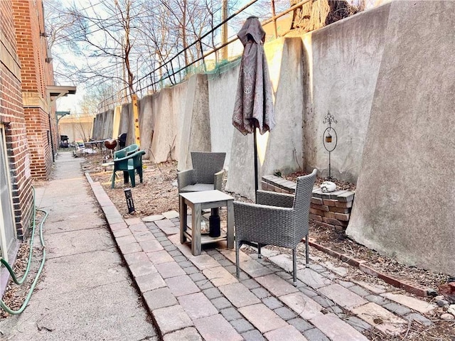 3116 12th Ave S Unit A209, Minneapolis, MN 55407 - view of patio / terrace with fence and a grill