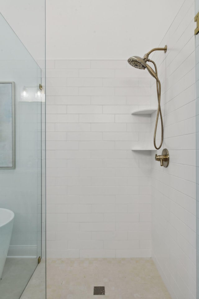 4549 Tovero Trl, Medina, MN 55340 - bathroom with walk in shower and a freestanding tub