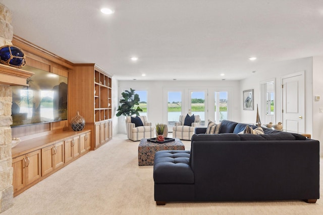 4549 Tovero Trl, Medina, MN 55340 - living room with light carpet, recessed lighting, and a water view