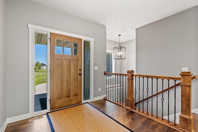 18041 224th Ave NW, Big Lake Twp, MN 55309 - entrance foyer with wood finished floors, a chandelier, and baseboards