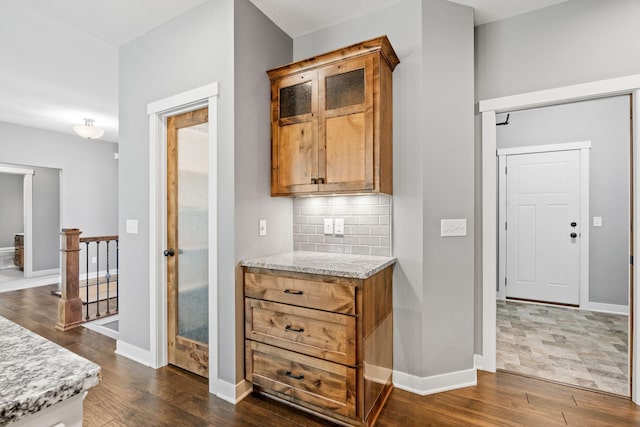18041 224th Ave NW, Big Lake Twp, MN 55309 - kitchen featuring dark wood finished floors, tasteful backsplash, and baseboards