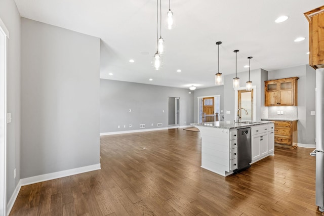 18041 224th Ave NW, Big Lake Twp, MN 55309 - kitchen with stainless steel dishwasher, recessed lighting, a center island with sink, dark wood finished floors, and baseboards