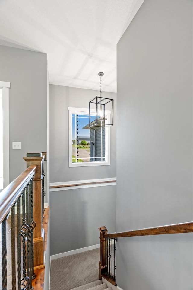 18041 224th Ave NW, Big Lake Twp, MN 55309 - stairway with a chandelier, baseboards, and carpet flooring