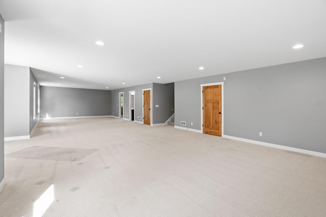 18041 224th Ave NW, Big Lake Twp, MN 55309 - unfurnished room featuring light colored carpet, recessed lighting, baseboards, and stairs