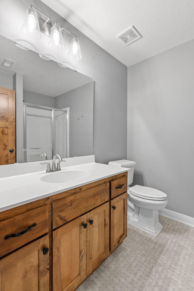 18041 224th Ave NW, Big Lake Twp, MN 55309 - full bathroom featuring a stall shower, toilet, vanity, a textured ceiling, and baseboards