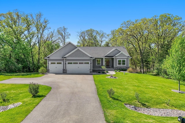 18041 224th Ave NW, Big Lake Twp, MN 55309 - view of front of property with driveway, a front yard, a garage, and stone siding