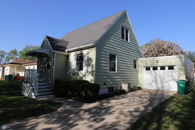 view of front facade with concrete driveway and central air condition unit