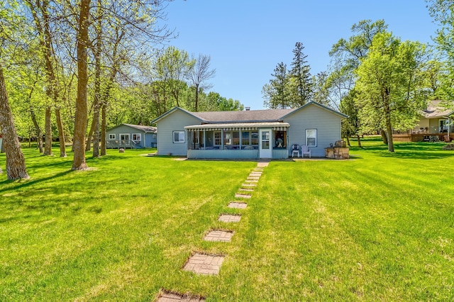 23620 Melissa Dr, Lake View Twp, MN 56501 - back of house with a sunroom and a lawn