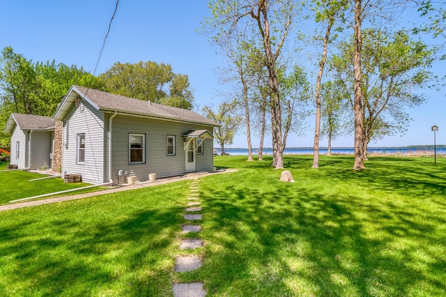 23620 Melissa Dr, Lake View Twp, MN 56501 - back of house featuring a water view, a yard, and roof with shingles