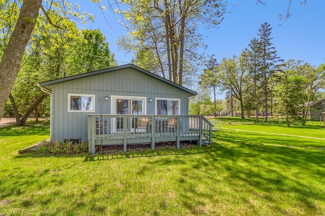 23620 Melissa Dr, Lake View Twp, MN 56501 - rear view of property with a deck and a lawn
