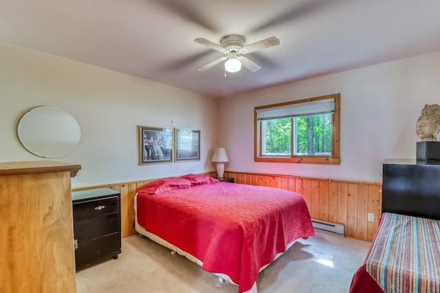 23620 Melissa Dr, Lake View Twp, MN 56501 - bedroom featuring baseboard heating, wainscoting, light carpet, wooden walls, and ceiling fan