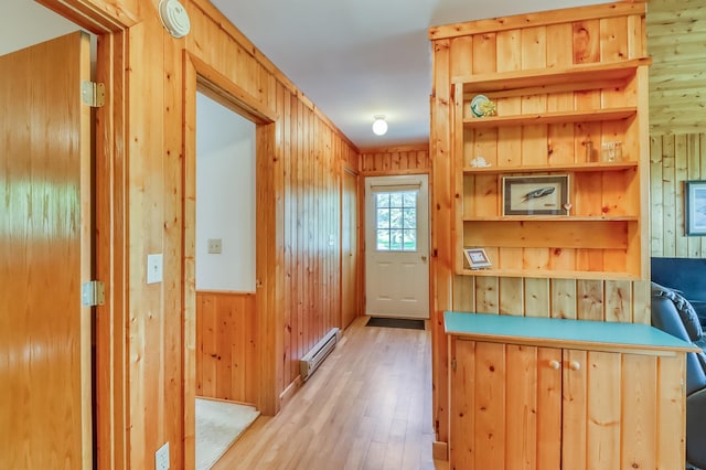 23620 Melissa Dr, Lake View Twp, MN 56501 - entryway featuring a baseboard radiator, wood walls, and light wood-style flooring