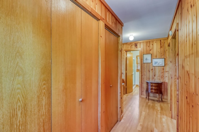23620 Melissa Dr, Lake View Twp, MN 56501 - hallway with light wood-style flooring and wood walls