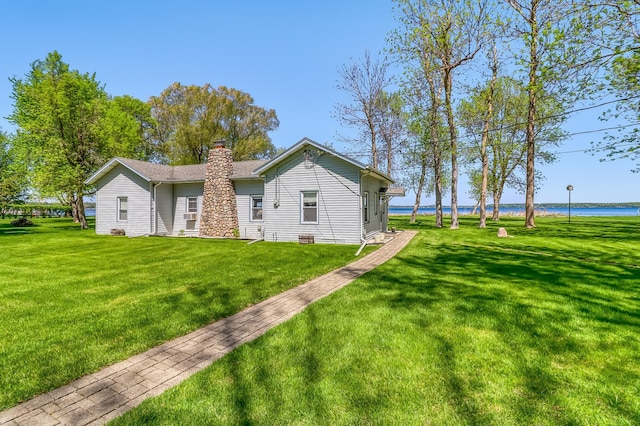 23620 Melissa Dr, Lake View Twp, MN 56501 - rear view of property featuring a chimney, a water view, and a lawn