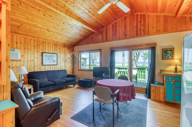 23620 Melissa Dr, Lake View Twp, MN 56501 - living area featuring vaulted ceiling, a ceiling fan, healthy amount of natural light, wooden walls, and wood finished floors