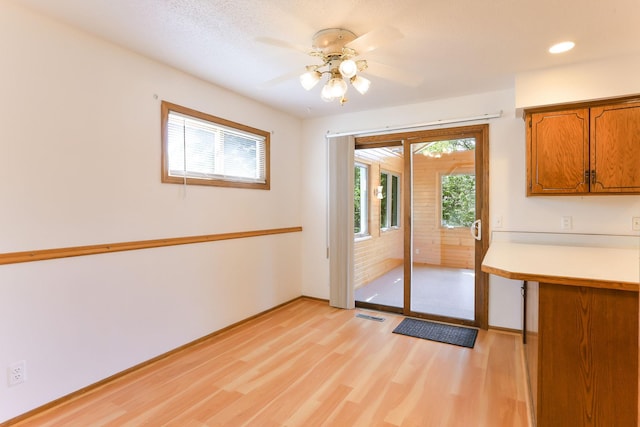 5391 Cottage Ave, White Bear Twp, MN 55110 - unfurnished dining area featuring light wood-style flooring, ceiling fan, and recessed lighting