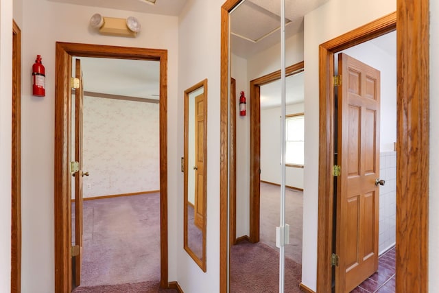 5391 Cottage Ave, White Bear Twp, MN 55110 - hall featuring dark carpet and baseboards