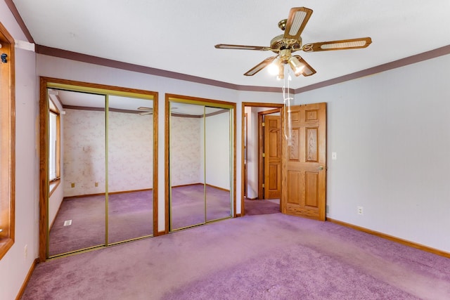 5391 Cottage Ave, White Bear Twp, MN 55110 - unfurnished bedroom featuring multiple closets, carpet floors, and a ceiling fan