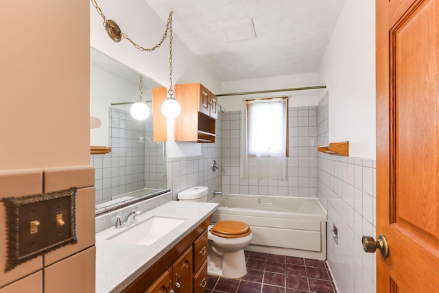 5391 Cottage Ave, White Bear Twp, MN 55110 - bathroom with tile walls, tile patterned floors, vanity, and bathtub / shower combination