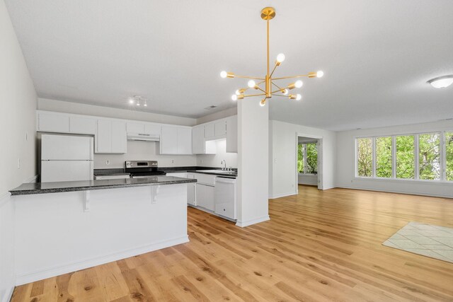 9018 Neill Lake Rd, Eden Prairie, MN 55347 - kitchen with white appliances, under cabinet range hood, open floor plan, white cabinets, and a kitchen breakfast bar