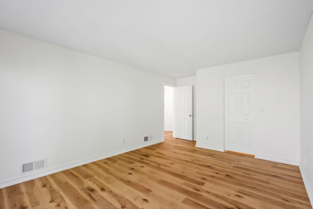 9018 Neill Lake Rd, Eden Prairie, MN 55347 - spare room featuring light wood-style floors and baseboards