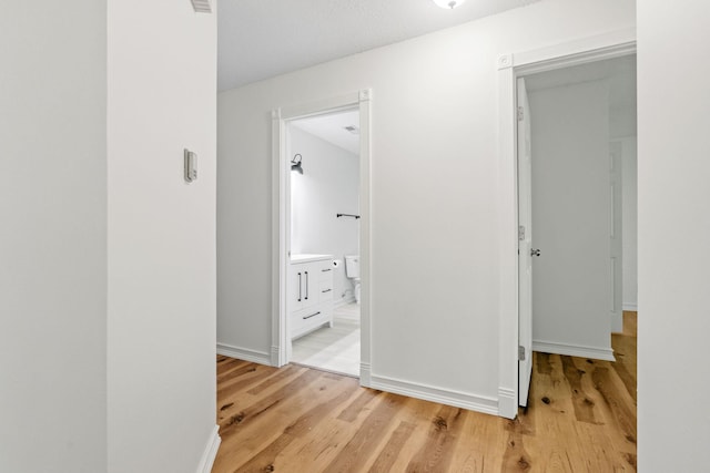 9018 Neill Lake Rd, Eden Prairie, MN 55347 - corridor with light wood-type flooring and baseboards