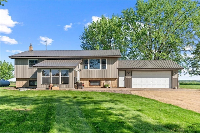 E7065 County Road B, Tainter Twp, WI 54730 - tri-level home with brick siding, a front lawn, and dirt driveway