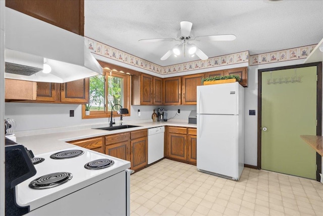 E7065 County Road B, Tainter Twp, WI 54730 - kitchen featuring white appliances, a sink, light countertops, ceiling fan, and brown cabinets
