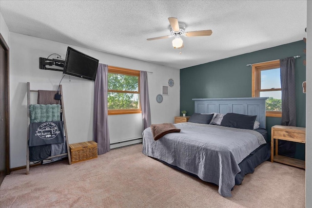 E7065 County Road B, Tainter Twp, WI 54730 - bedroom featuring a baseboard radiator, light carpet, a ceiling fan, and a textured ceiling