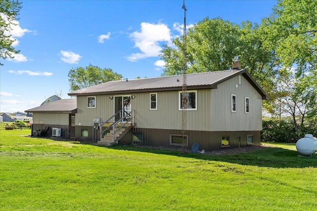 E7065 County Road B, Tainter Twp, WI 54730 - back of property with a yard, a chimney, and metal roof