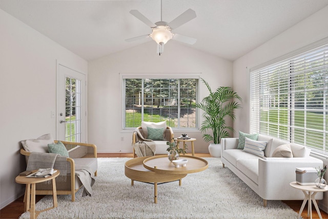574 Marsh Dr, Delano, MN 55328 - living area with vaulted ceiling, wood finished floors, a ceiling fan, and baseboards