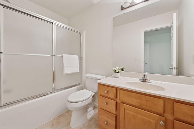 574 Marsh Dr, Delano, MN 55328 - full bathroom with toilet, vanity, tile patterned flooring, and enclosed tub / shower combo
