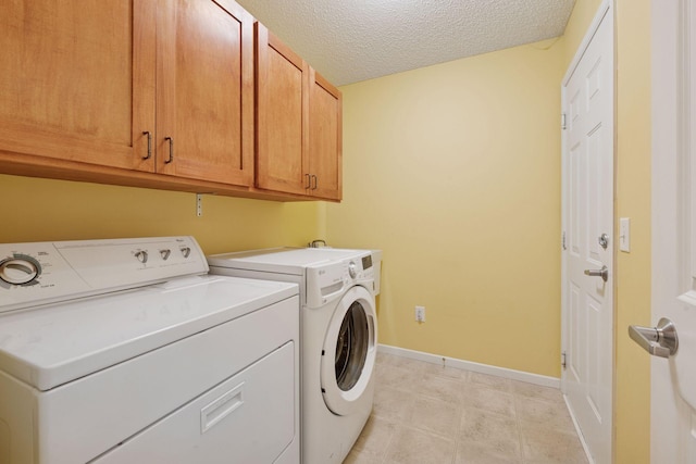 574 Marsh Dr, Delano, MN 55328 - laundry area featuring separate washer and dryer, cabinet space, baseboards, and a textured ceiling