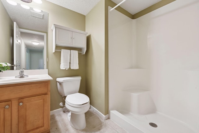 574 Marsh Dr, Delano, MN 55328 - full bath with a shower stall, toilet, a textured ceiling, vanity, and tile patterned floors